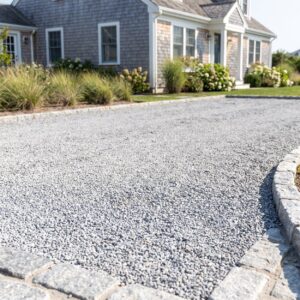 Gravel driveway Cape May County property with a defined stone edge